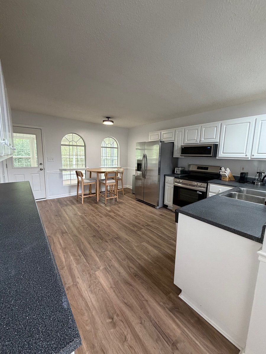 Open kitchen with dining table.