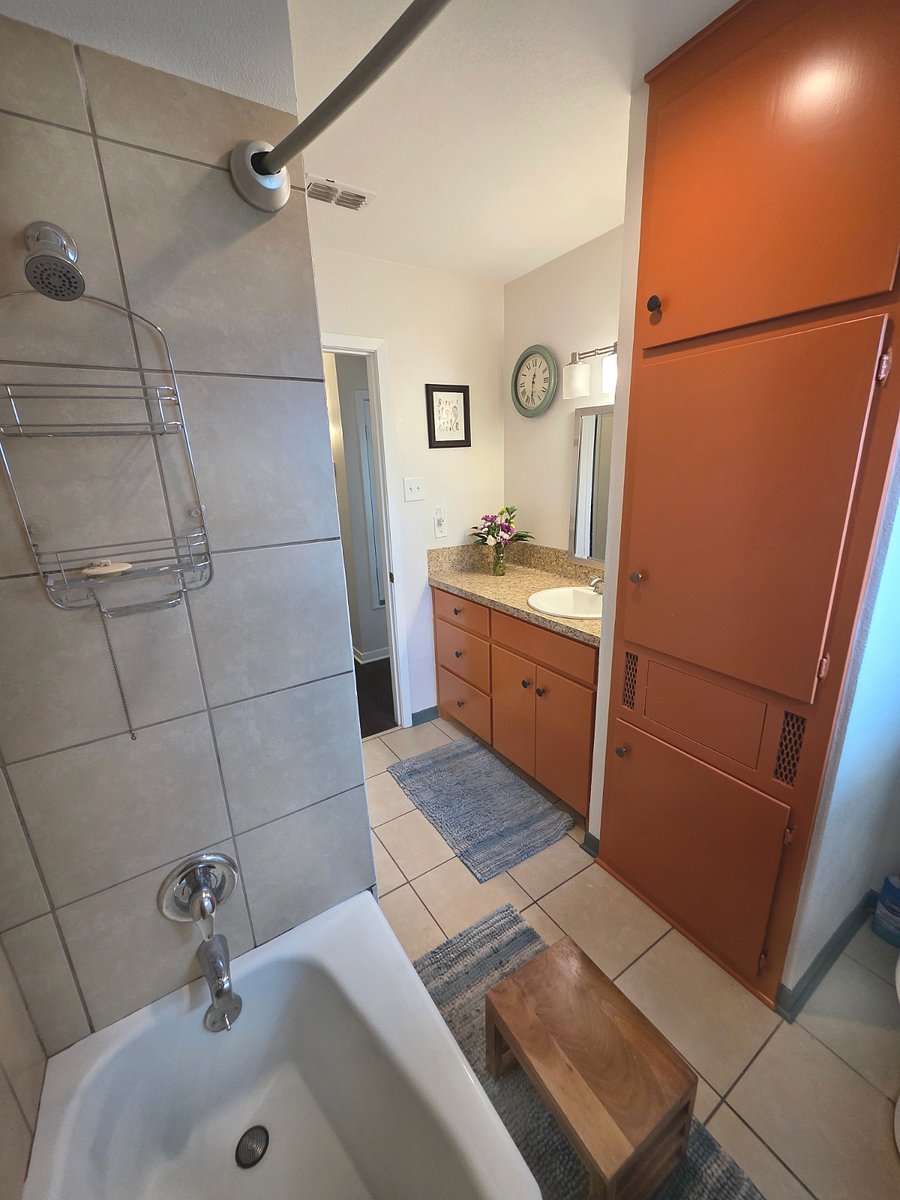 Large Full Bathroom with built in laundry hamper at Pecan Porch Retreat