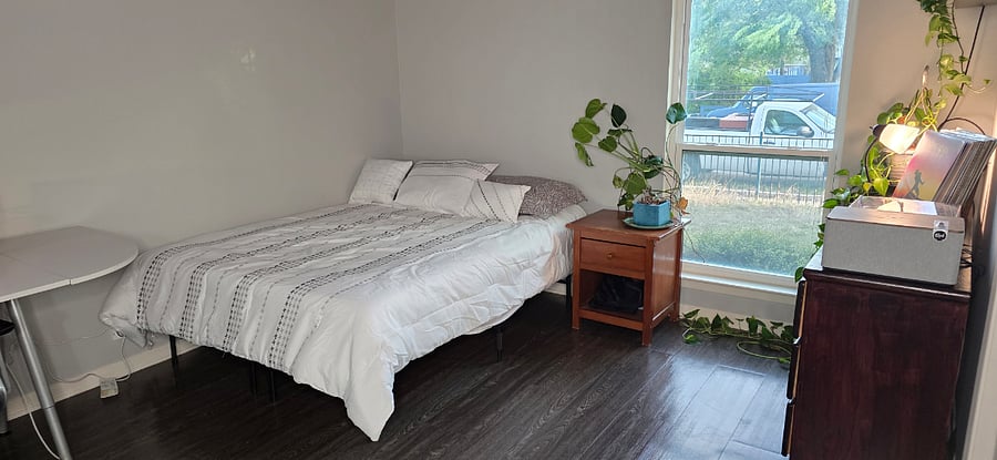 Queen Bed, plants, turntable record player, Klipsch speaker, workspace for up to two with L-shaped desk