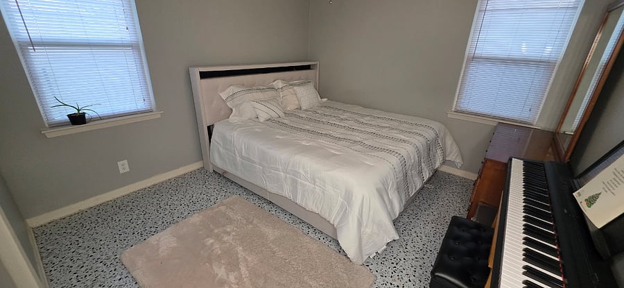 King bed & Piano room with dresser and mirror. Plus workspace desk coming soon. Available starting April 2026