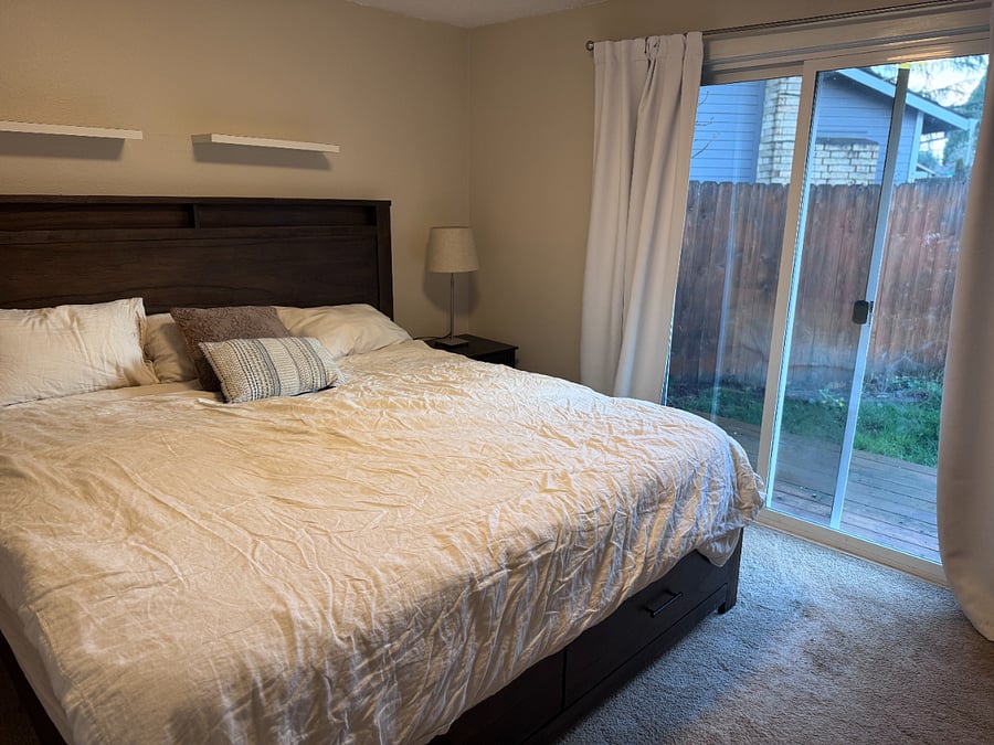 Master King bed with sliding glass door with access to deck.