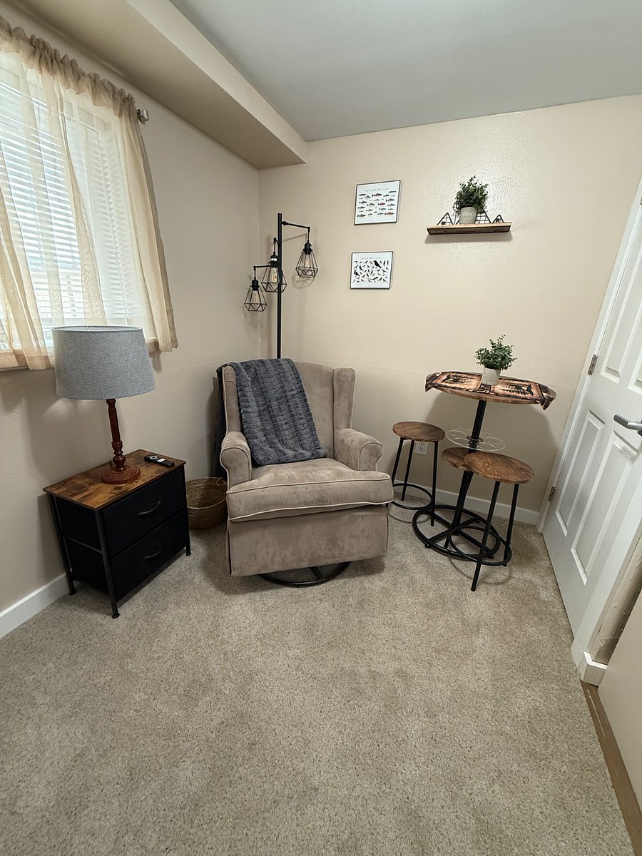 Private living room next to kitchenette. Pub style table for two.