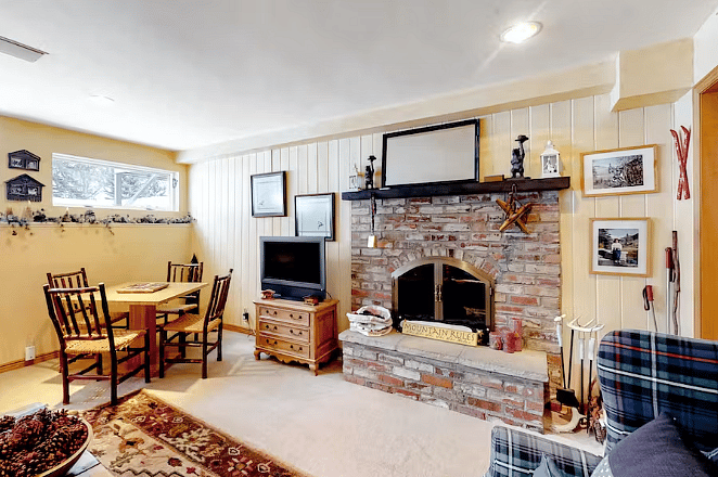 Lower level family room with wood burning fireplace