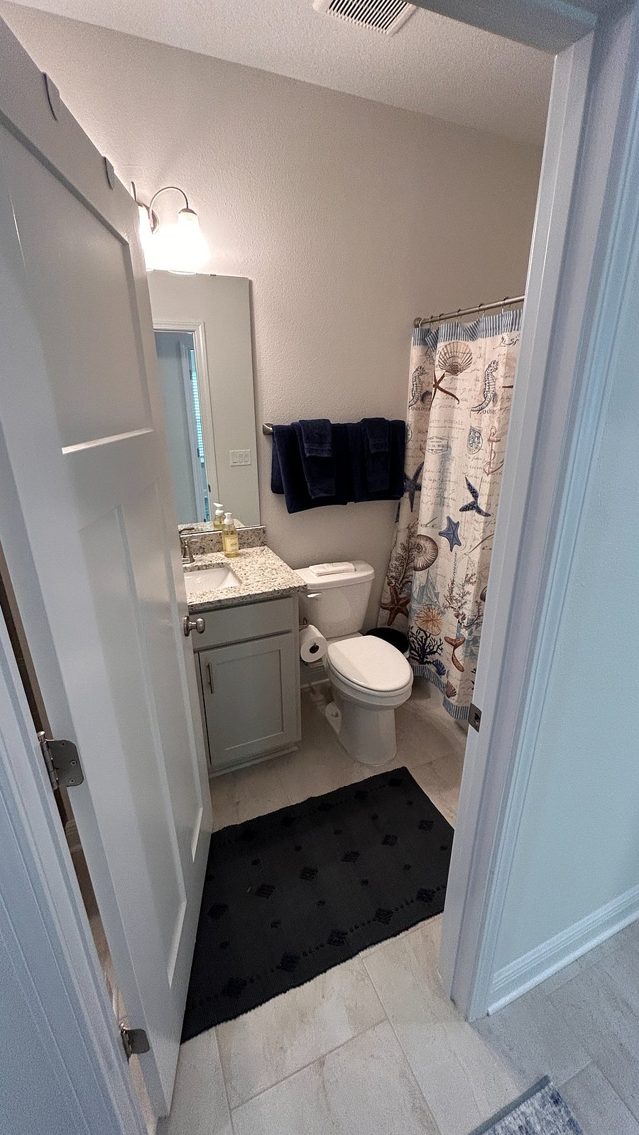 Hall bathroom with shower tub combination