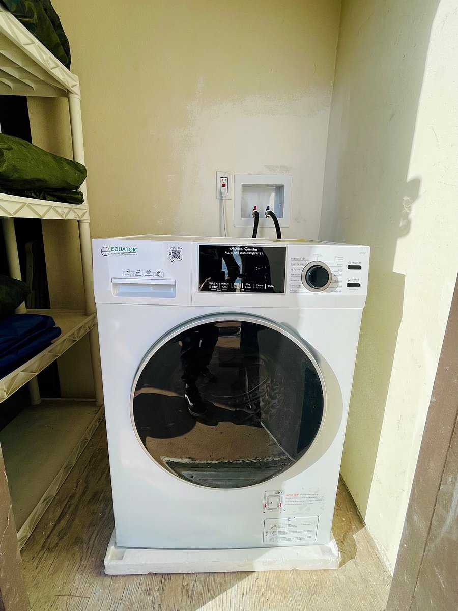 Private laundry closet with new 2 in 1 washer & dryer combo.