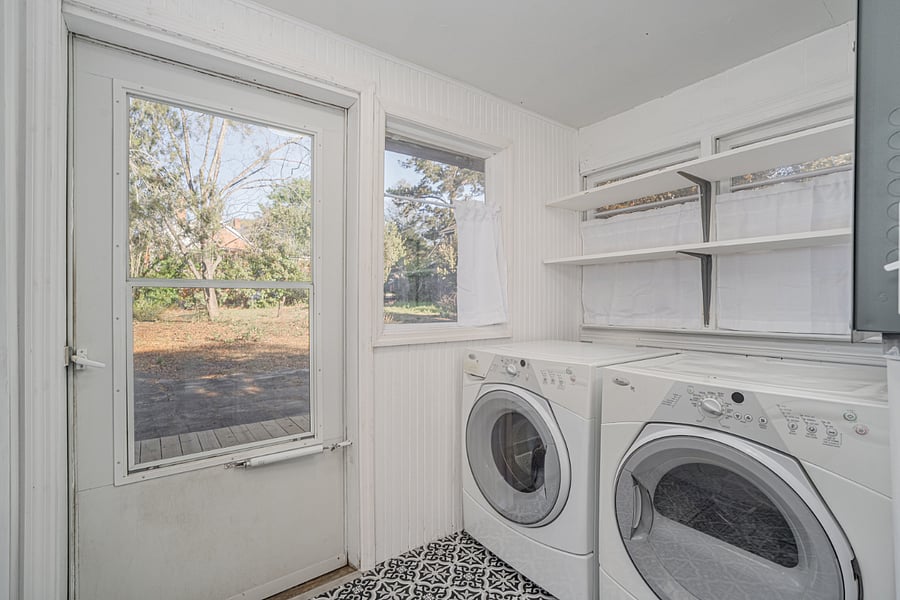 Dedicated laundry room with shelving