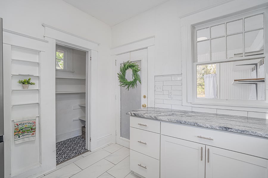 Kitchen has pantry and plenty of natural lighting