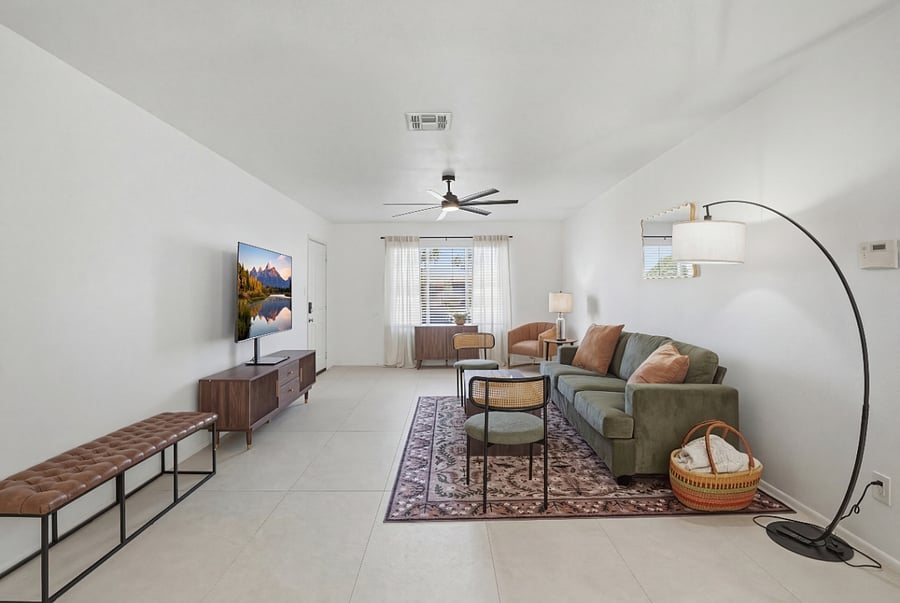Living area with a large TV to enjoy movie night!