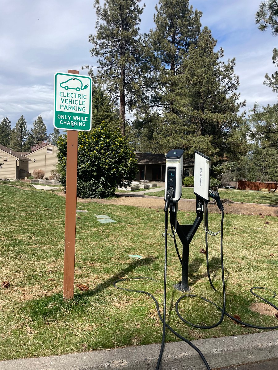 EV charger in parking lot just outside condo