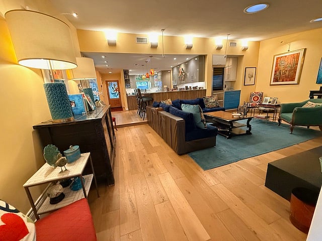 living room toward front door/kitchen