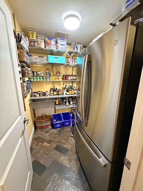 pantry with additional full refrigerator