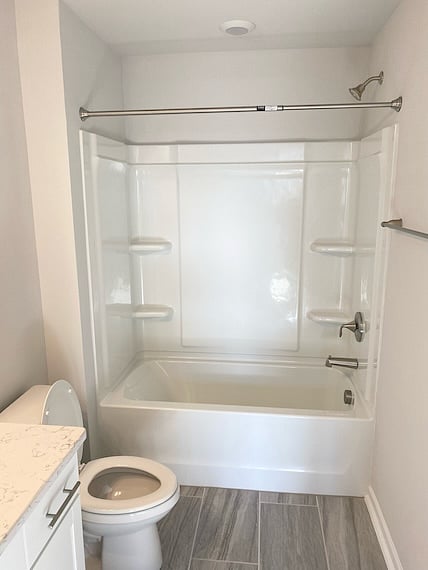 Shower/tub combo in secondary full bathroom.