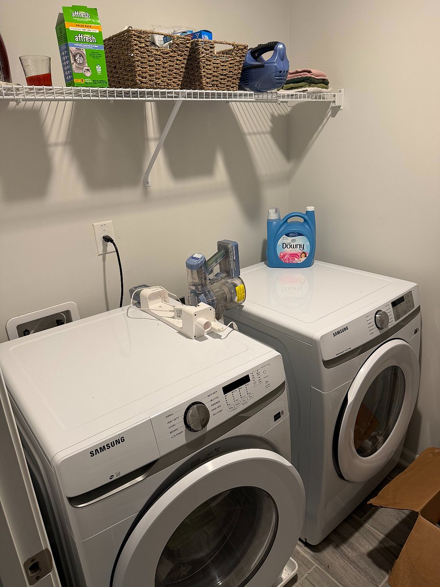 Samsung front-loading washer and dryer (new in 2025). Laundry room off upstairs hallway has utility storage - mounted brooms, mops, & space for laundry baskets, step-ladder, etc. Laundry & cleaning starter supplies.