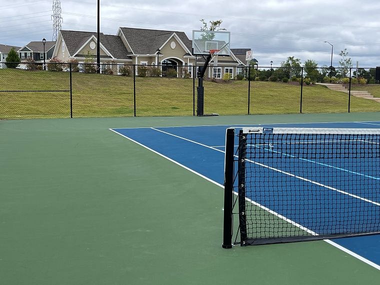 Outdoor tennis/pickle ball courts. Multiple dog parks.