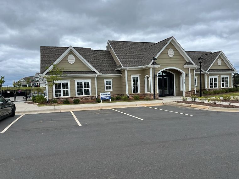 Clubhouse amenties include weight room, kitchen, party/lounge area, & bathrooms open to outdoor pool.