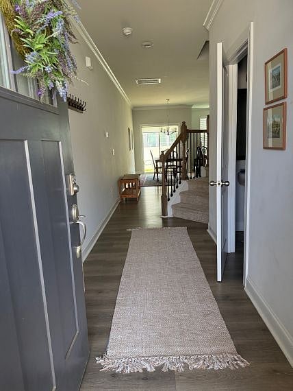 View from foyer: neutral LVP floors, coat closet & half bath on R, just before stairs. Dining room w/slider to patio & fenced yard. Open floor plan: den & kitchen to R. of dining room.