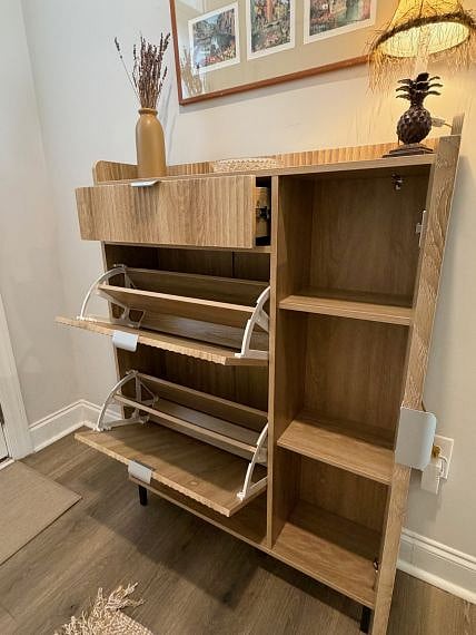 Opened shoe cabinet at front entry.