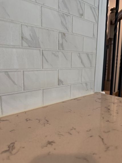 Gorgeous subway tile backsplash & quartz countertops.