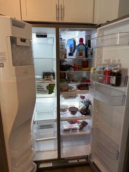 Large Whirlpool side-by-side refrigerator/freezer.