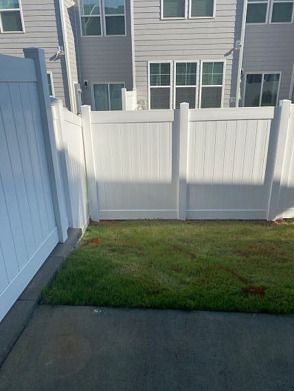 Small, fenced yard (added 2025) w/gate. HOA maintains front & back yards/perennial trimming. Weekly curbside waste/recycling pick up.