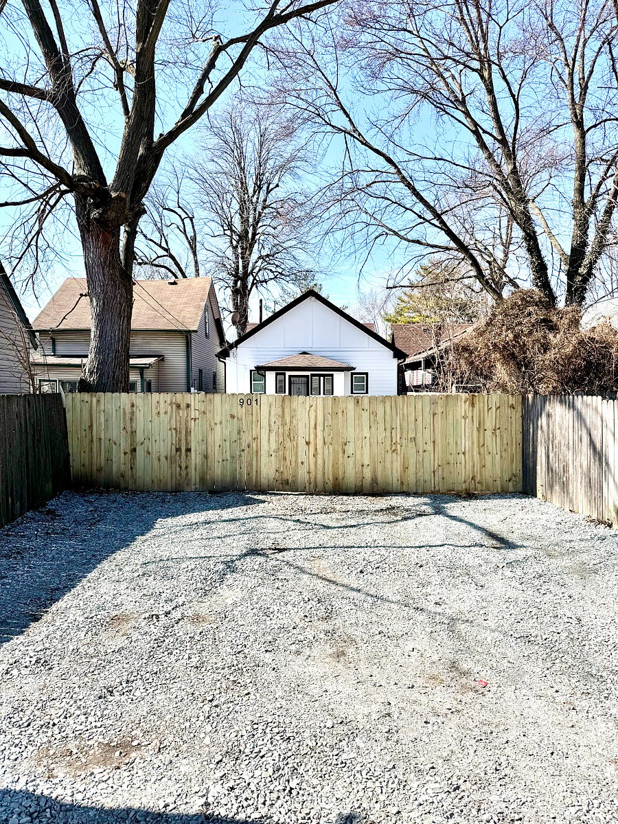 Private parking pad behind home with access through alleyway