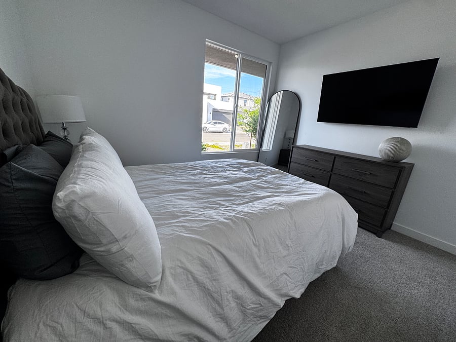 Bedroom one, Queen size bed, foam mattress, two nightstands, six drawer, dresser, full length mirror, ceiling, fan, smart TV.