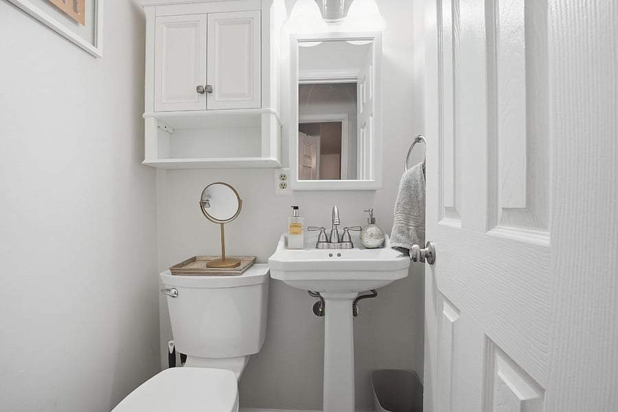 Convenient Half Bath for Added Comfort & Privacy
This additional half bathroom offers extra convenience and flexibility during your stay. Thoughtfully finished with a pedestal sink, toilet, mirror, and storage, its perfect for everyday use and helps reduce traffic to the main bathroom, which features the tub/shower.

Ideal for guests who appreciate added privacy and functionality, this secondary bathroom makes mornings easier and shared living more comfortable, an especially valuable feature for longer stays.