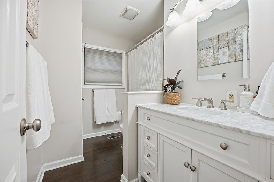 Master Bathroom 

Enjoy a bright, clean, and thoughtfully updated master bathroom designed to make your stay as comfortable and convenient as possible, perfect for traveling nurses with demanding schedules. The space features a spacious vanity with a marble countertop and multiple drawers, giving you plenty of room to organize toiletries and essentials for longer stays.

A full shower/tub combo offers flexibility whether you need a quick refresh before a shift or a relaxing soak afterward. Fresh, modern finishes, excellent lighting, and a large mirror make getting ready easy at any hour.

The bathroom also includes ample storage, soft towels, and easy-to-maintain hardwood flooring just outside the bath area, ideal for a clean, low-maintenance living space. A window provides natural light while maintaining privacy, helping create a calm, spa-like environment. Shared spaces in the home are professionally cleaned on a regular basis, adding an extra layer of comfort and peace of mind during your stay.

This private master bath is designed to feel both functional and peaceful, giving you a quiet place to reset and recharge after long shifts.

Highlights:

Private master bathroom

Spacious vanity with drawers for storage

Marble countertop & modern fixtures

Shower/tub combo

Bright lighting + large mirror

Fresh, clean, and updated finishes

Natural light with privacy

Professionally cleaned shared spaces

Easy-to-maintain flooring