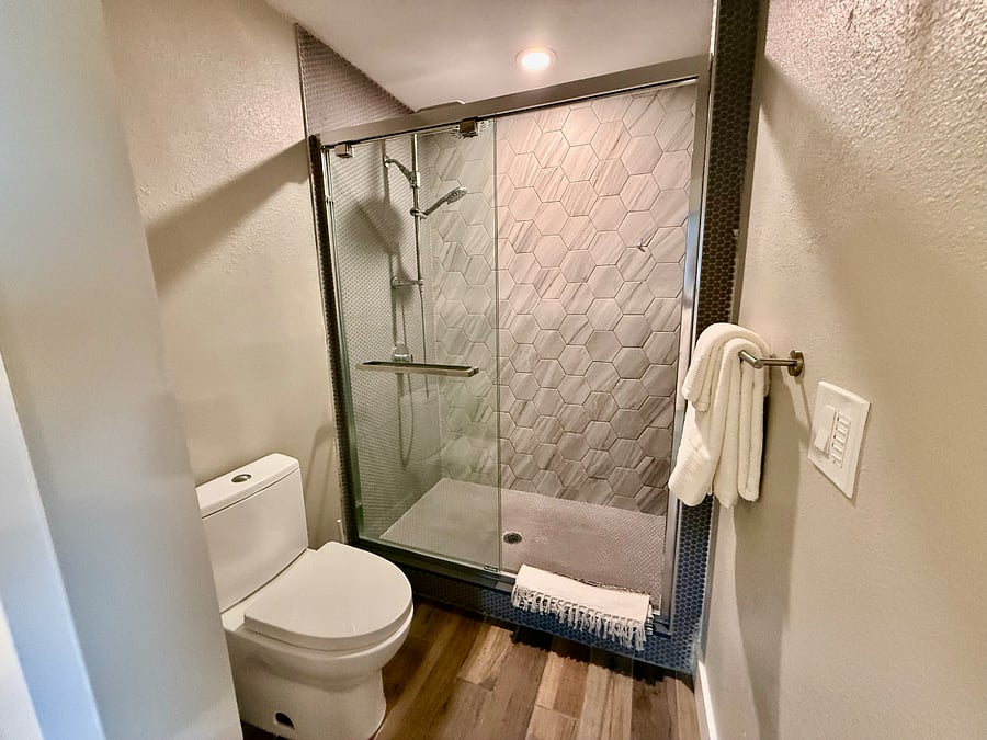Large walk-in shower with rain style shower head