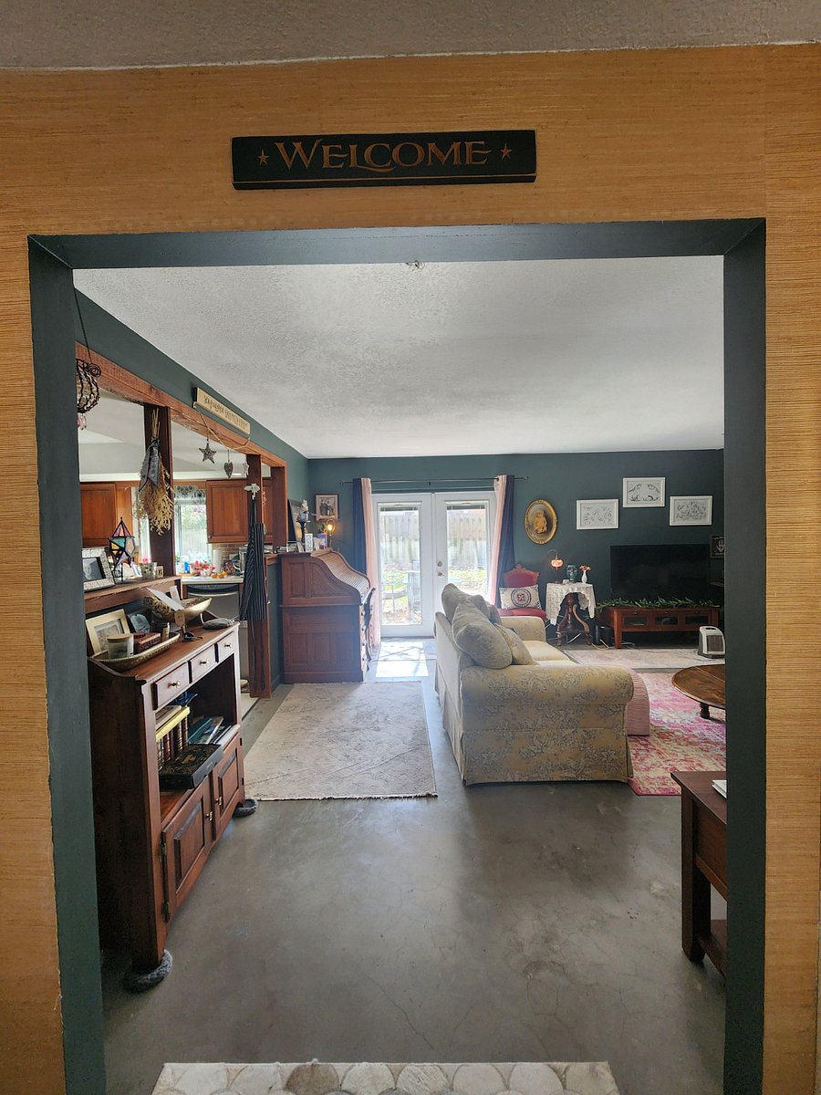 Upon entry, living area ahead and to the right while hallway with the 3 bedrooms is to the left.