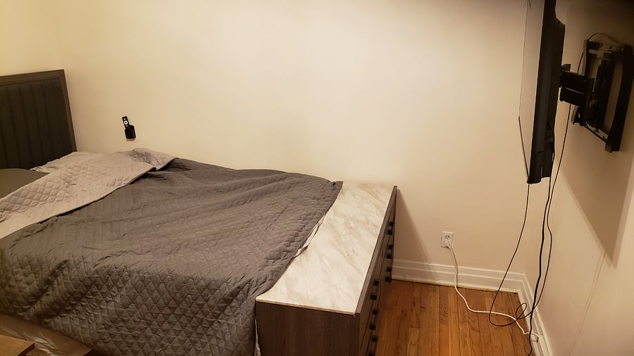 Bedroom 1: Bed and TV and storage
