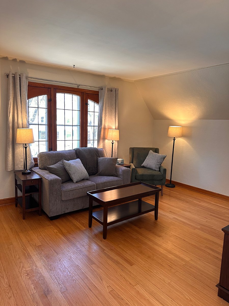 Spacious living area with large windows and abundant natural light
