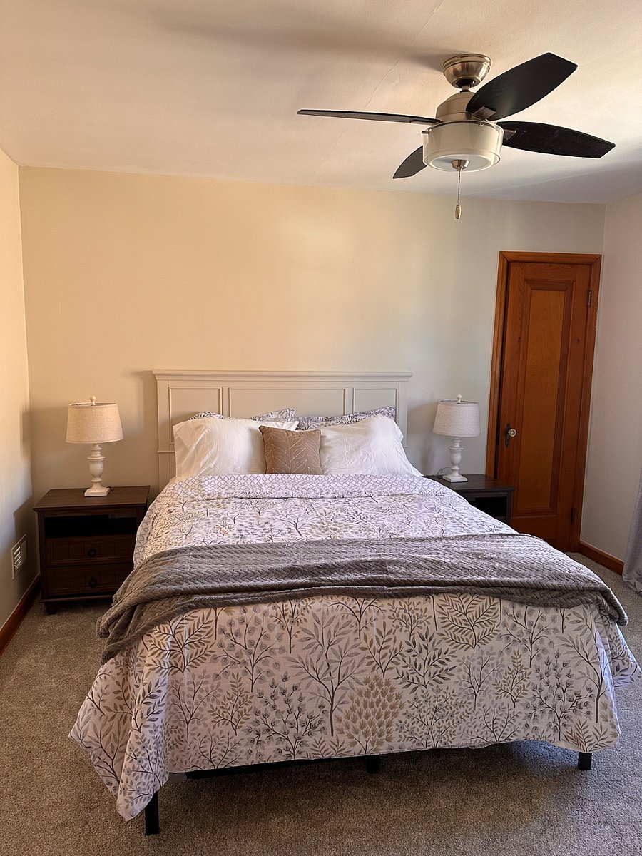 Cozy bedroom with comfortable queen bed (new mattress) and calming, neutral tones