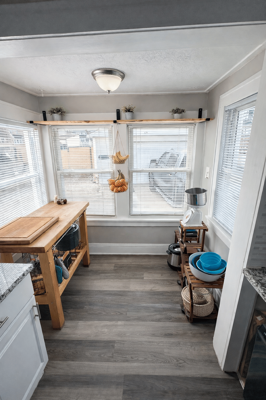 Shared breakfast nook connected to the kitchen, overlooking the backyard and driveway. 