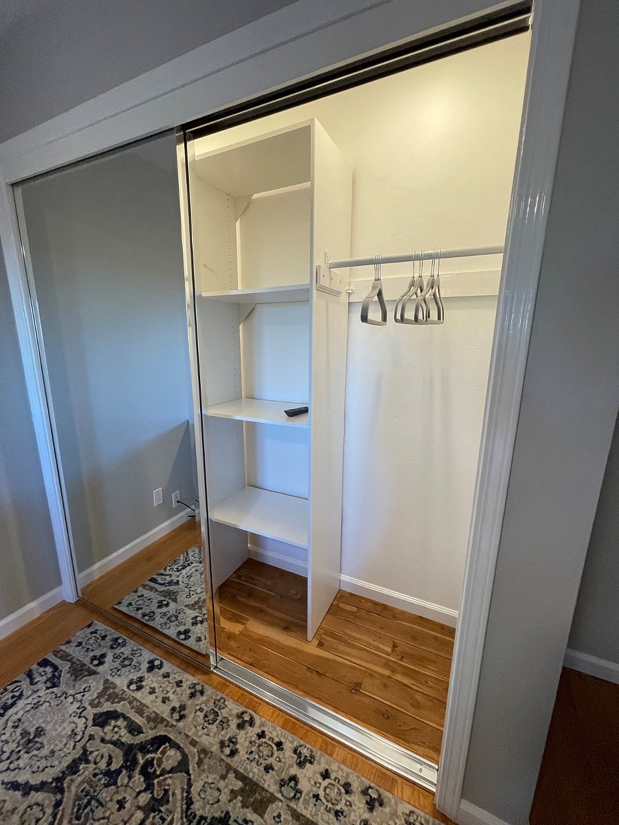Closest has mirrored doors and interior lights.
