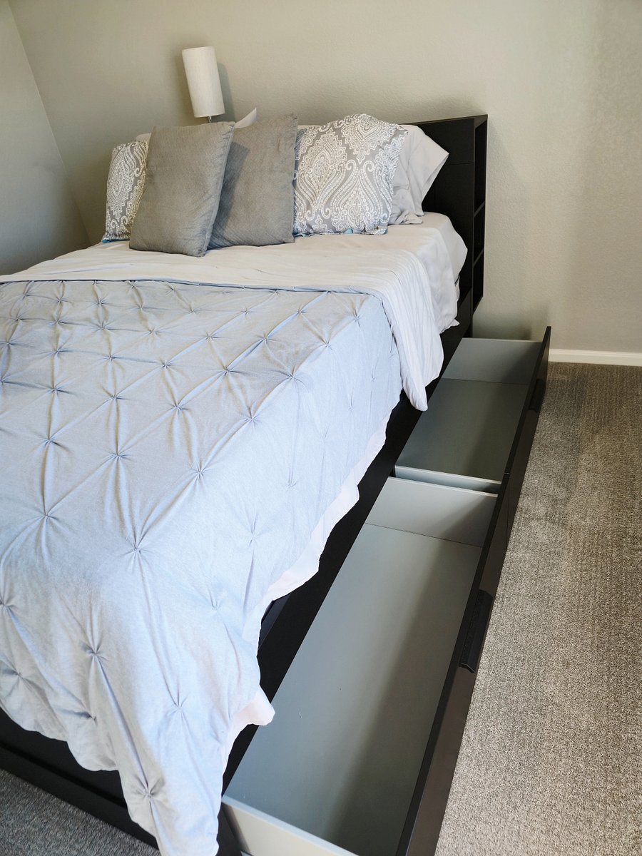 Large drawers for storage on both sides of bed