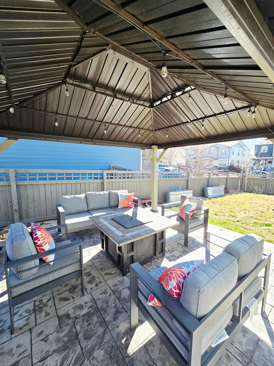 Gazebo with outdoor furniture and gas firepit. Grill included, just not pictured.