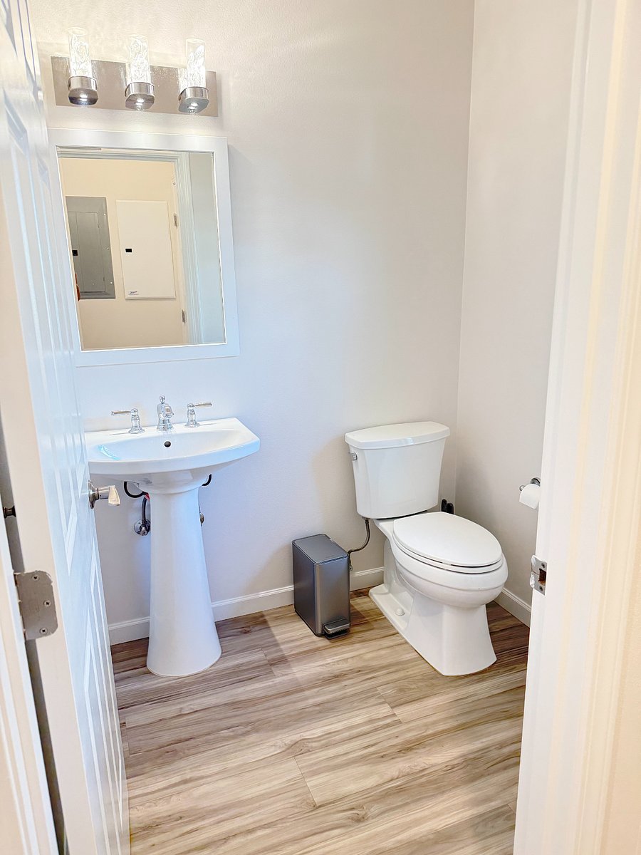 Half bathroom next to living room