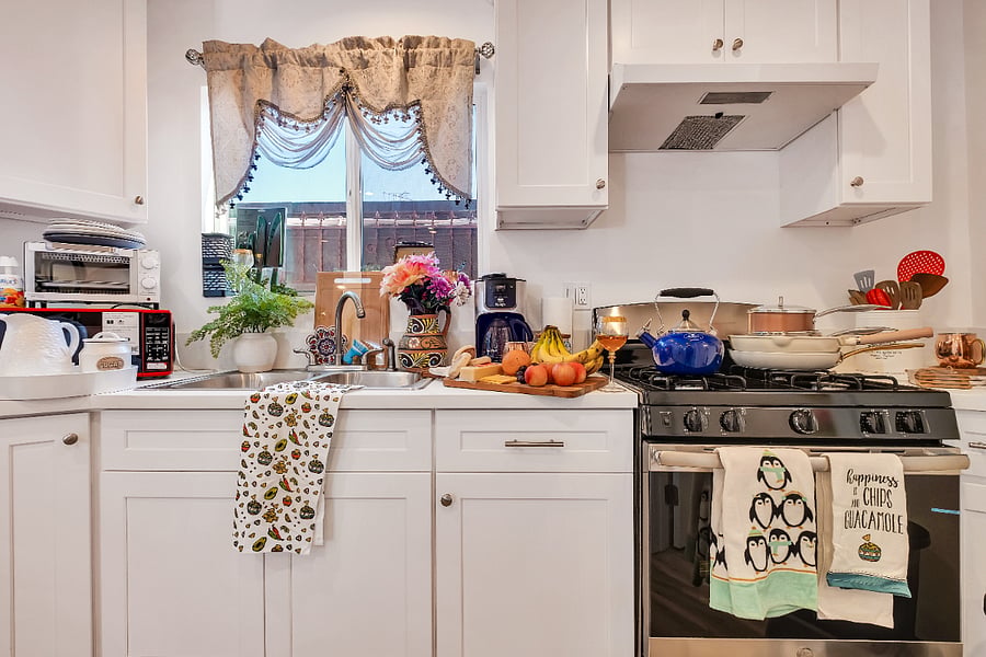 Convenient prep station featuring a deep sink, sharp knives, and solid cutting boards