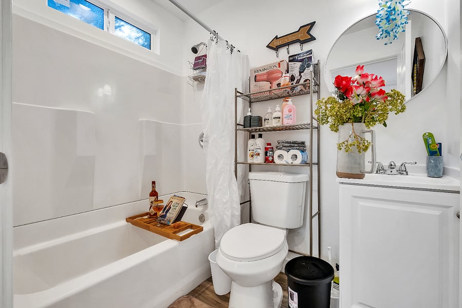 Deep soaking bathtub perfect for unwinding with a glass of wine & book after a long day