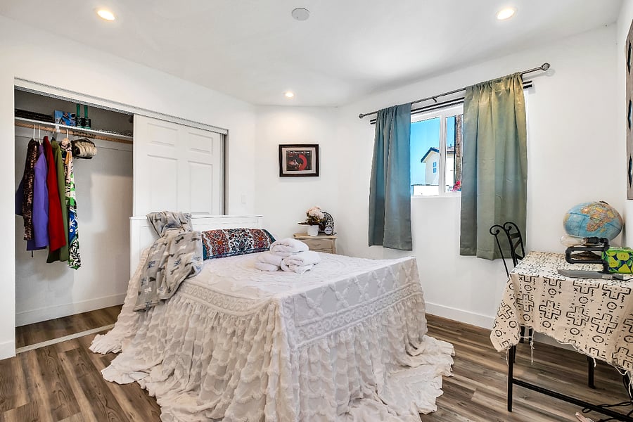 This bedroom with a full size bed provides a quiet, peaceful retreat with a dedicated workspace featuring a high-speed Wi-Fi connection