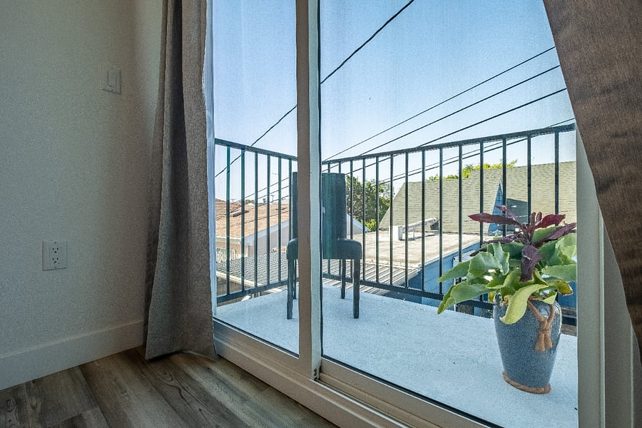 Cozy up with a good book in this sunny balcony, in front of the masters bedroom