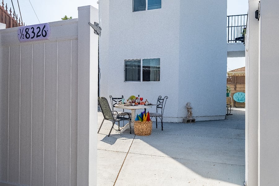 Dinner is servedal fresco style. This expansive outdoor with a dining table comfortably seats the entire family