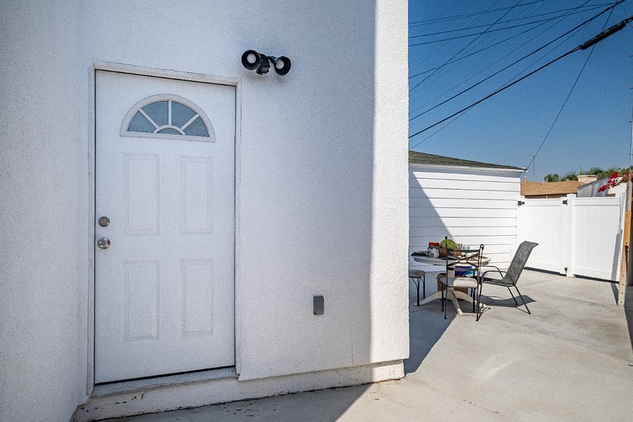 Open this door to seamlessly blend a cozy bedroom room with a beautiful backyard