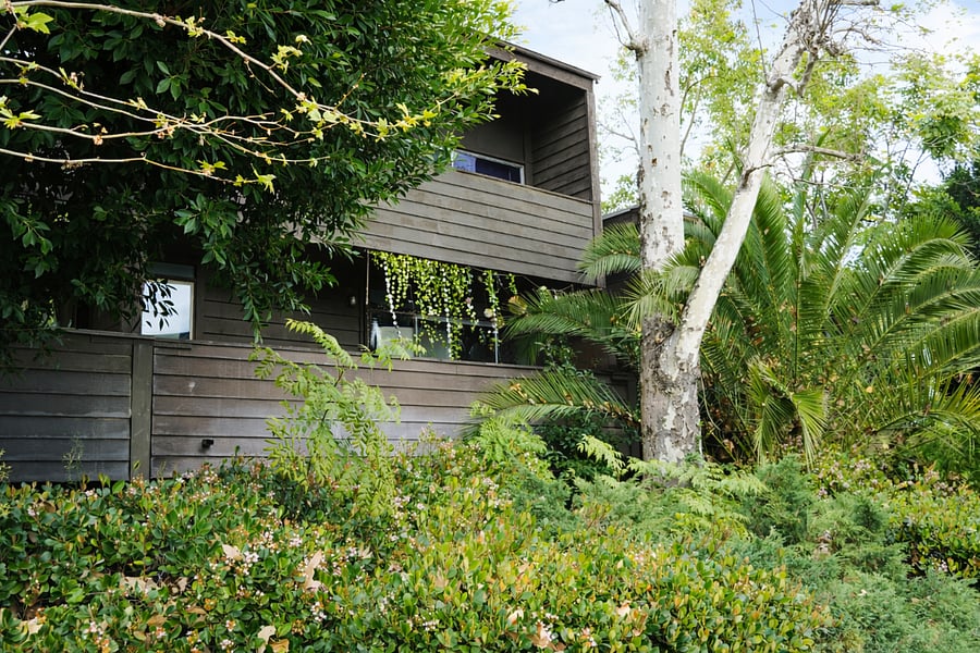 Well maintained community entrance with landscaped walkway.