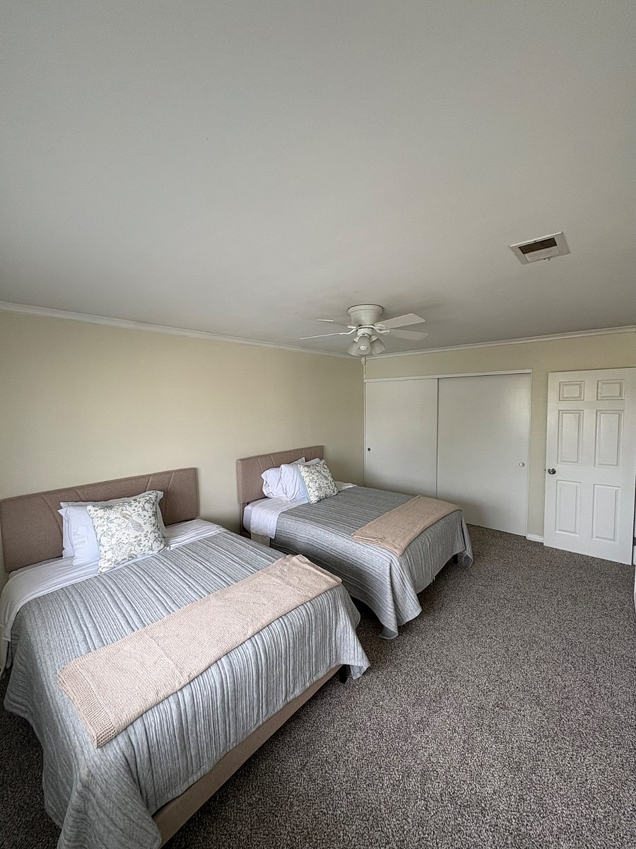 Alternate view of the bedroom highlighting the generously sized closets.