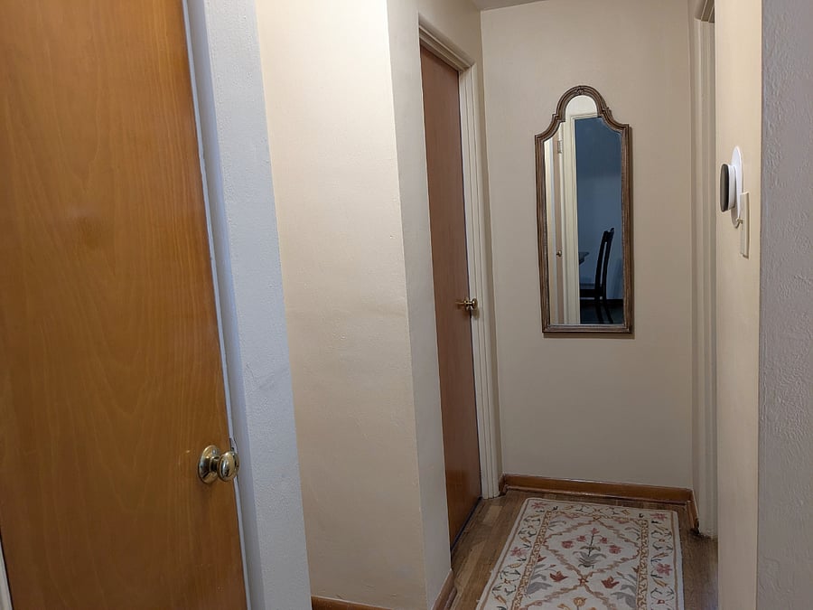 hallway leading to 2 bedrooms