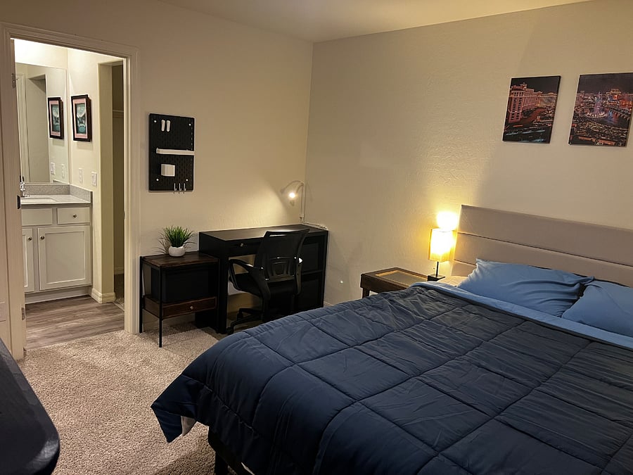 Room 3 / Master BR - Queen Size Bed, Side Lamps, Desk Table and swivel chair, wall orhanizer/peg board, and side table.
