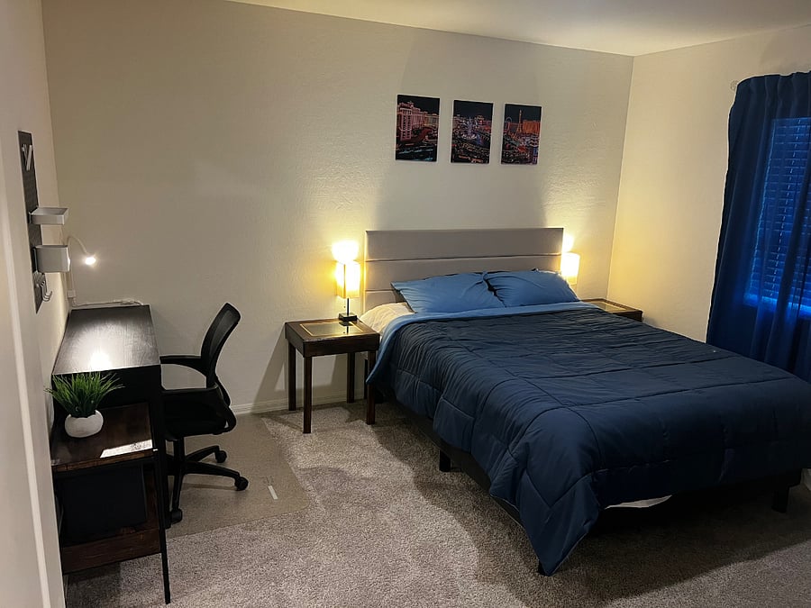 Room 3 / Master BR - Queen Size Bed, Side Lamps, Desk Table and swivel chair, wall organizer/peg board, and side table.