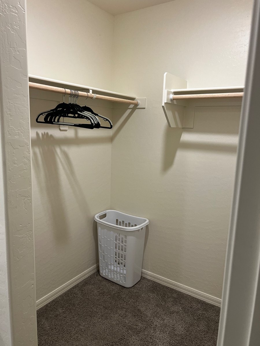Full Bathroom 2 / Master BR - walk-in closet with hangers and hamper.